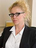 Blonde Taya shows off her massive breasts in these office pics